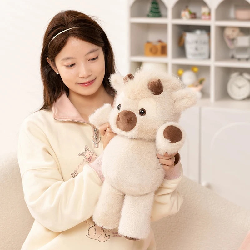 Woman hugging the fluffy cow plush