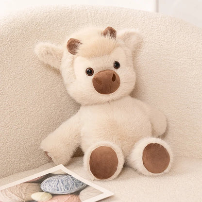 Voraki running cow plush sitting on a sofa