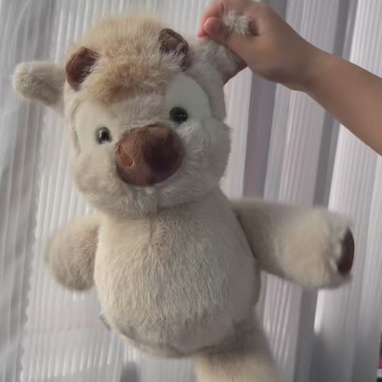Video of the running cow plush swinging its legs when shaken